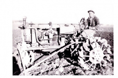 J.W. Wiggins on Farmall tractor