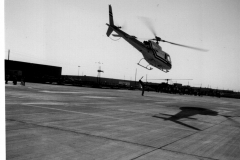 Helicopter in midair at Garland Heliport, Jupiter Road and Grader St