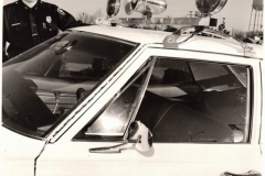 Policeman with new car