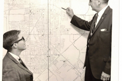 Police chief with student and  street map