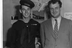 Sailor in uniform with man in business suit