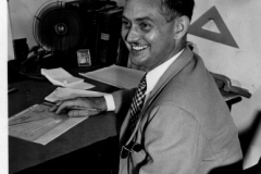 Man at desk, July 1945  (Name on back of photo)
