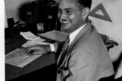 Man at desk, July 1945  (Name on back of photo)
