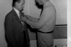 Man receiving pin
