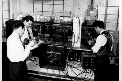 Three men in plant, Feb. 5, 1946