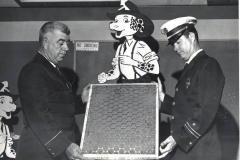 Garland Fire Department, Lt. Vernon Poore, left, showing air filter to another fireman in 1968