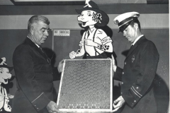 Garland Fire Department, Lt. Vernon Poore, left, showing air filter to another fireman in 1968