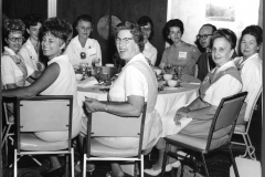 Group of volunteers at a luncheon.  Mary Browne on the far right in original pinafore. Circa 1959-1962.