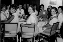 Group of volunteers at a luncheon.  Mary Browne on the far right in original pinafore. Circa 1959-1962.