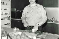 Fire fighter Robert Fultz preparing meal