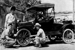 Fay Nelson, owner of Nelson's Blacksmith Shop, and son P.J. "Pete", in front of Model T roadster (circa 1946). Nelson's Blacksmith Shop worked on automobiles, farm implements and anything else broken or dull.