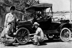 Fay Nelson, owner of Nelson's Blacksmith Shop, and son P.J. "Pete", in front of Model T roadster (circa 1946). Nelson's Blacksmith Shop worked on automobiles, farm implements and anything else broken or dull.