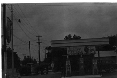 Shugart's new modern station with ice house; also shows Mrs. Rupard's garage