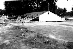 Roof of Smith's Laundry floated off walls during Duck Creek flood, ca June 1949