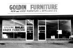 Goldin Furniture and Appliance store - Front of store with "Opening Sale" sign in window