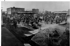 West side of square and partial north side, ca 1908. On the right hand side of the photo, Crossman Insurance, or an early iteration, is visible, along with the word notary.