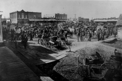 West side of square and partial north side, ca 1908. On the right hand side of the photo, Crossman Insurance, or an early iteration, is visible, along with the word notary.