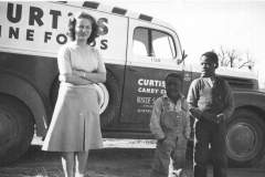 Virginia Ann Brand (Stone) in front of dad's truck, Roscoe Brand the Candy Man