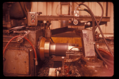IMCO 152 MM projectile lathe machining Looking west Cooper concrete on left Blue buildings were bomb press and heat treat