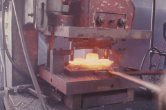 Steel Forging Press - Multiple Hole Bomb Lug Looking west Cooper concrete on left Blue buildings were bomb press and heat treat