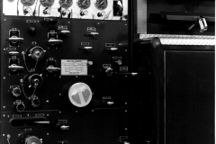 Control panel on Garland Fire Department Truck No. 18 (GFD designation E-418).  1966 Mack C85, 1000 Gallons per minute, 500 gal).  Location of the fire truck is at the Mack factory (Ref. L2015.02.E - Photograph of Firefighter at the control panel)