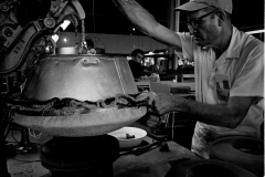 Martin McKinney of Byer-Rolnick Hat Corporation, Garland, ironing the brim of a hat 1966