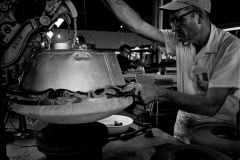 Martin McKinney of Byer-Rolnick Hat Corporation, Garland, ironing the brim of a hat 1966