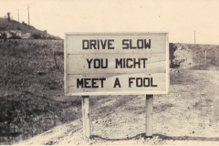 Texas road sign that reads 'DRIVE SLOW YOU MIGHT MEET A FOOL".