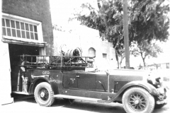 Elmer Bechtol, sittinng in an old Garland Fire Department truck