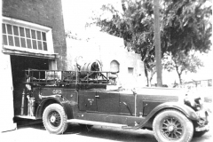 Elmer Bechtol, sittinng in an old Garland Fire Department truck