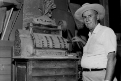 Donald Day Jones with H.W. Jones Hardware cash register