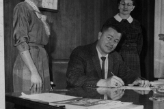 Ernie Wright, Mayor (Seated) proclaims special week. L and R - unknown Late 1950's