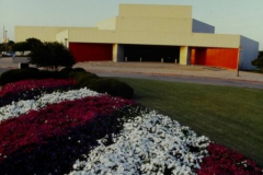 Garland Performing Arts Center front, bed of flowers in foreground