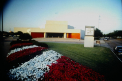 Garland Performing Arts Center front, bed of flowers in foreground