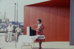 Ruth Nicholson speaking in front of Garland Performing Arts Center