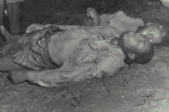 Two African American corpses on the ground following the April 26, 1958