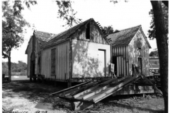 Lyles House renovation 1979 - new location before move. Train station and railcar.