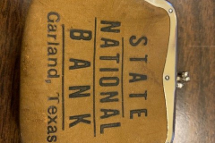 Small brown State National Bank coin purse.