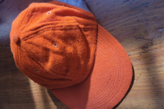 orange baseball hat