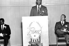 A group of people attending Lou Huff's reopening open house on February 2, 1969. Lou Huff had previously been closed for expansion. From left to right: ?, Frank Clarke, Mayor Ernie Wright, Jr.