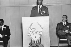 A group of people attending Lou Huff's reopening open house on February 2, 1969. Lou Huff had previously been closed for expansion. From left to right: ?, Frank Clarke, Mayor Ernie Wright, Jr.