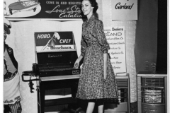 Trying out a barbecue Grll - Industrial Show April 1961