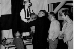 Publicity chairman Louis Howard greets "Sparky the Fire Dog"