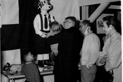 Publicity chairman Louis Howard greets "Sparky the Fire Dog"