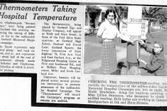Checking the temperature-reading which records the temperature of the million-dollar Garland Memorial Hospital Campaign are, left to right, Miss Marie Bradshaw, doing the touch-up painting, and Miss Lillian Sammons, who measures to check the audited reading.  Both ladies are working in Campaign Headquarters at 9th and State Streets.