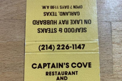 Captain’s Cove Restaurant and Club gold and black matchbook.