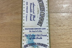 Southern Comfort liquor matchbook, white with blue and gold accents.