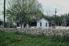 House & Stone Wall corner of Brand & Naaman School