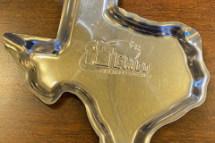 Temco silver-colored metal ashtray in the shape of Texas.