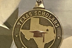 Medallion on red, white and blue lanyard - "Texas Scholars Garland ISD"